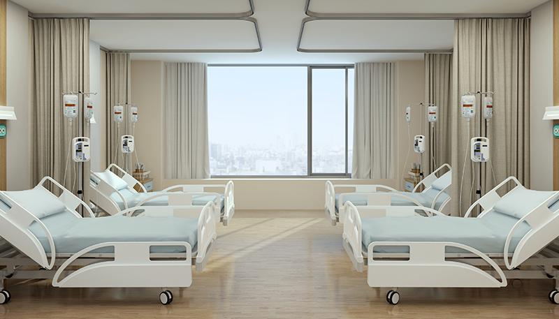 Hospital recovery room with beds and chairs